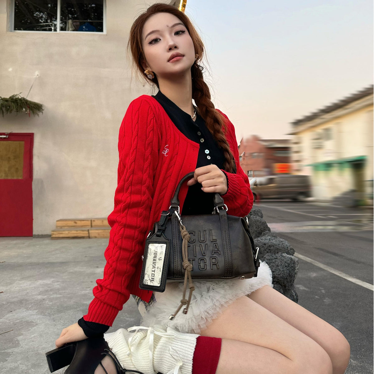 CULTIVATOR YS-24111 Mini Boston Bag Brown - Model Sitting Outdoors with Bag