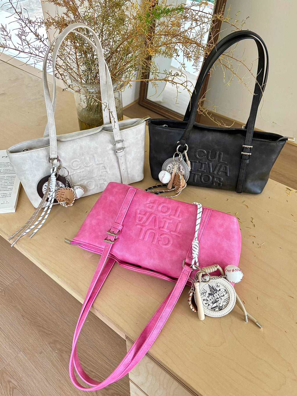 CULTIVATOR YS-24140 East-West Shoulder Bag - Three Colors on Table