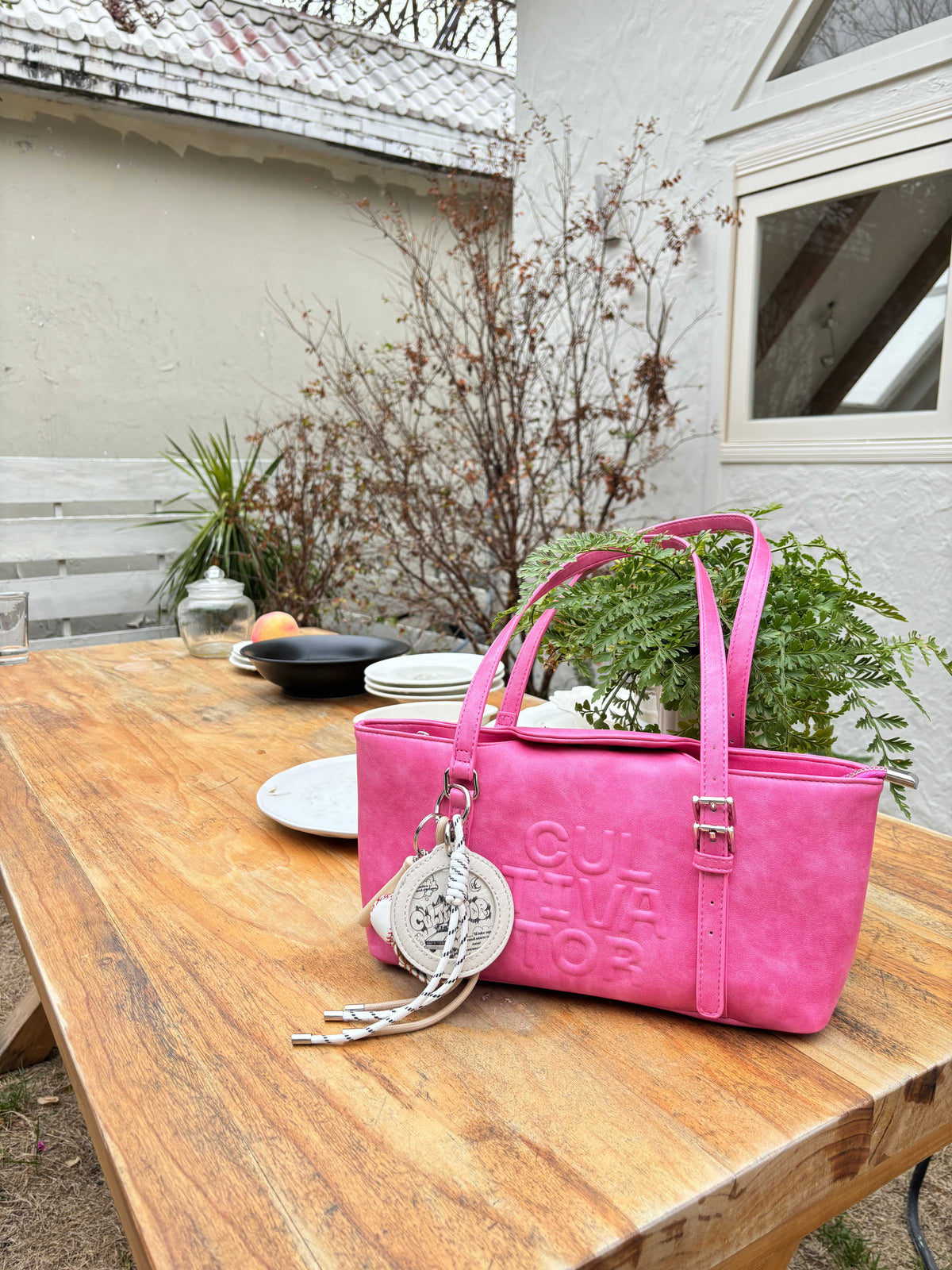 CULTIVATOR YS-24140 East-West Shoulder Bag Pink - Tabletop Still Life with Plant