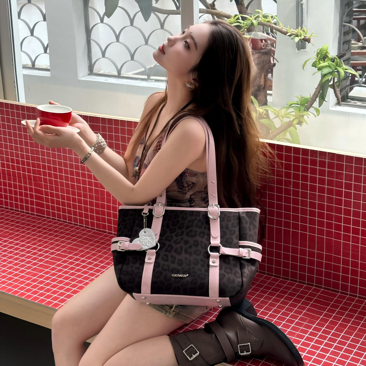 CULTIVATOR YS-25097 Leopard Commuter Tote Brown - Model on Red Tile Bench with Coffee