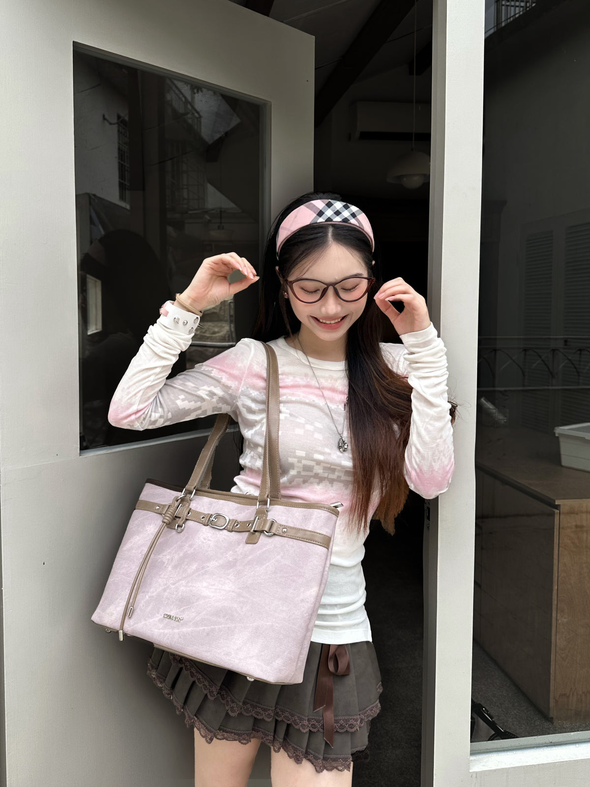 CULTIVATOR YS-26035 Belted East-West Tote Pink - Model Looking Down Smiling