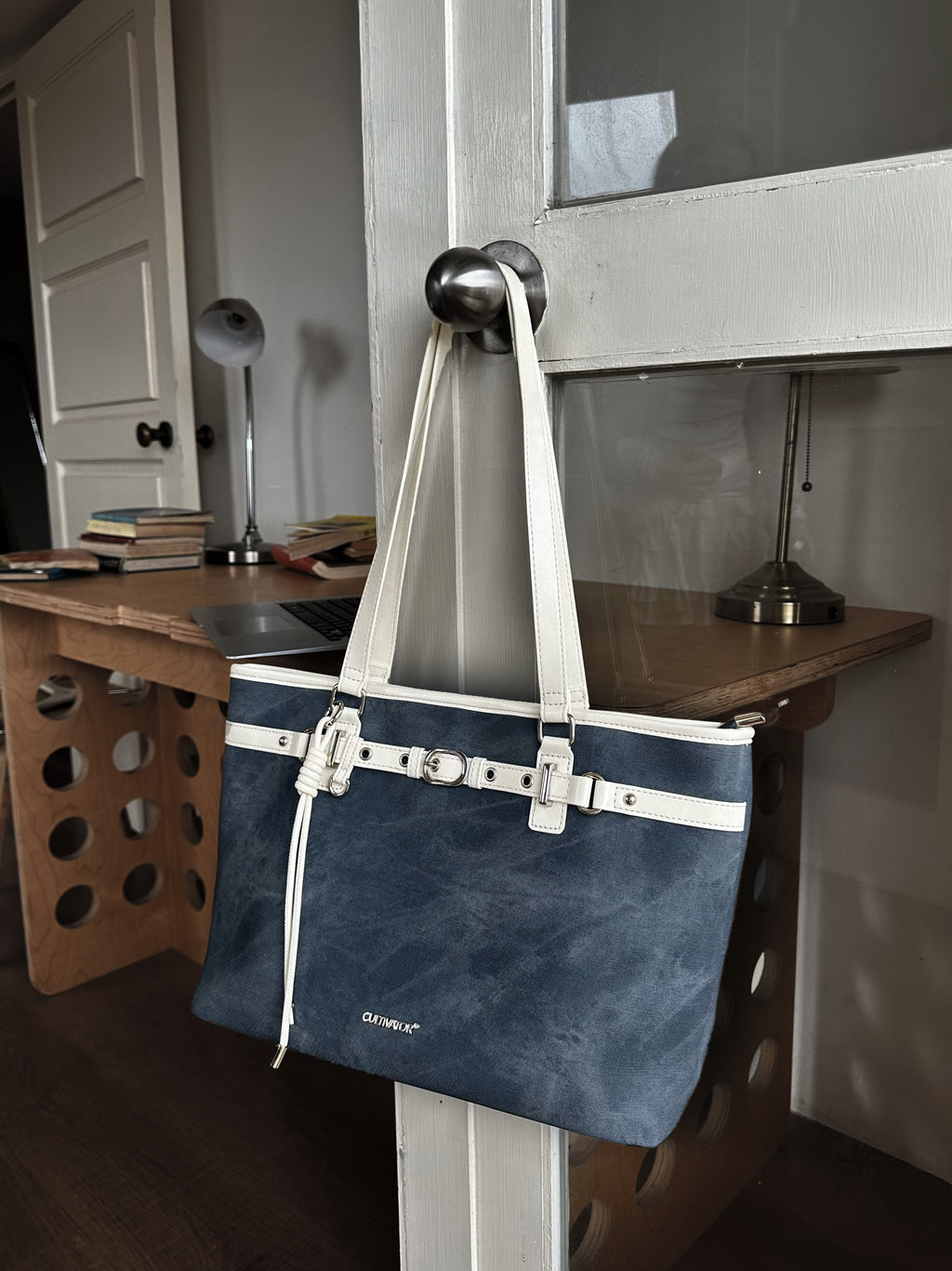 CULTIVATOR YS-26035 Belted East-West Tote Blue - Hanging on Door Knob