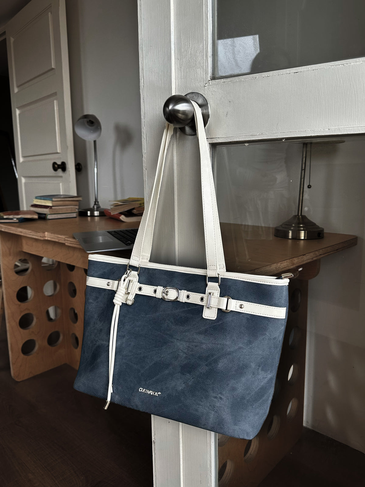 CULTIVATOR YS-26035 Belted East-West Tote Blue - Hanging on Door Knob